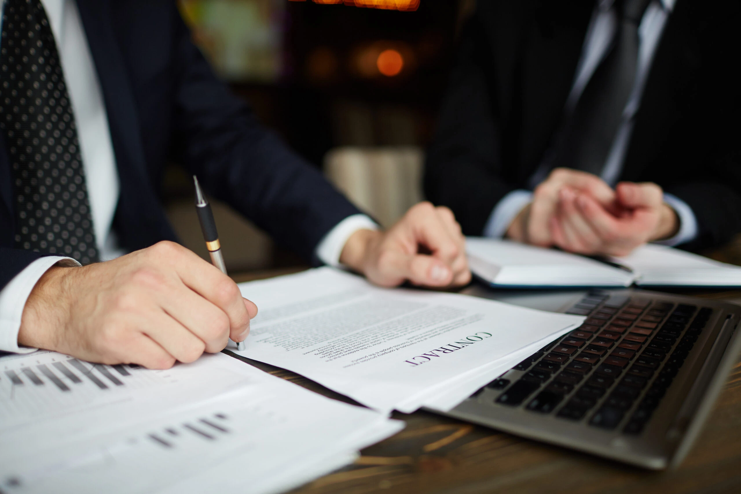 Business professional reviewing legal documents and compliance requirements—representing corporate legal compliance services.
