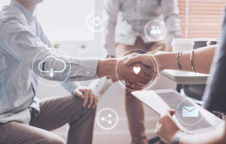Two people shaking hands to represent personalized and trusted bookkeeping support