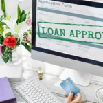 A person applying for a business loan with a “Loan Approved” screen in the background, highlighting the role of bookkeeping for business loans in successful applications.