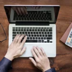 Canadian small business owner reviewing integrated bookkeeping software reports