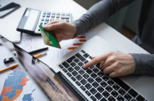 A person typing credit card details.